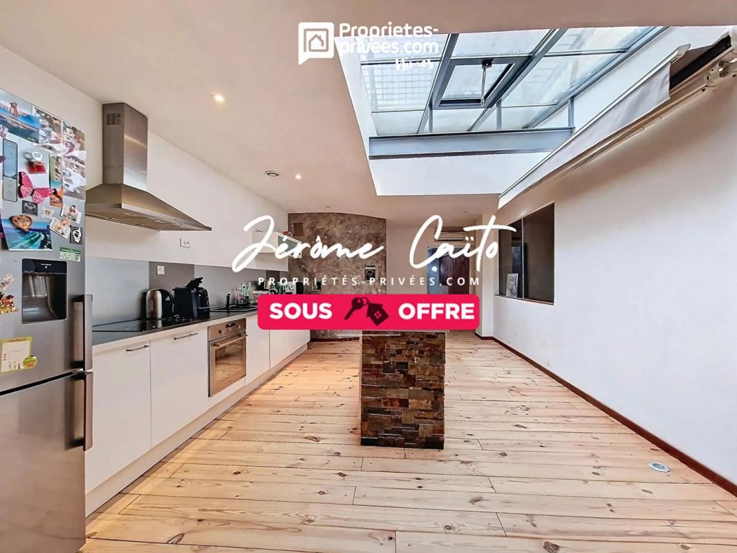Appartement loft 4 pièce(s) 105 m2 + garage
