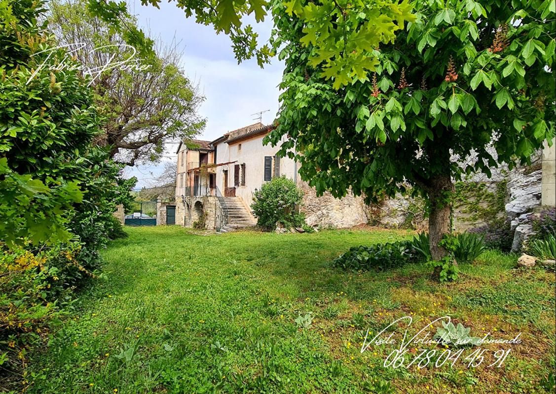 Maison 6 pièce(s) 128 m2  et combles aménageables 49m²  avec caves et terrain dans un village