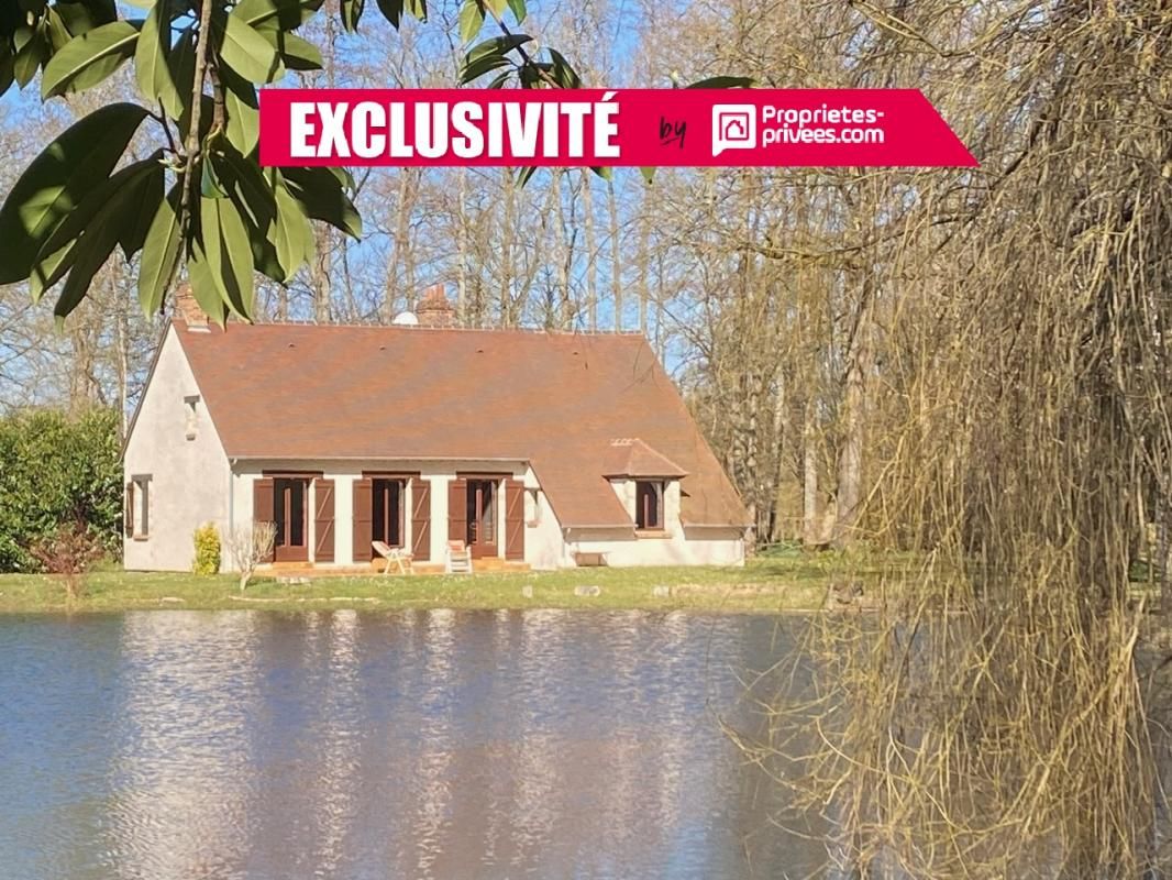 MONTARGIS Propriété idyllique au bord d'un étang PRIVATIF, terrain arboré de plus de 2 Hectares bordé par une rivière 1