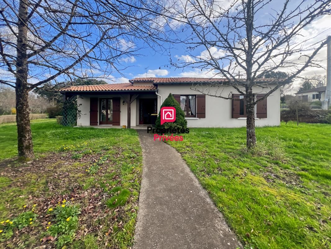 Maison de plain-pied - 3 chambres - garage et jardin